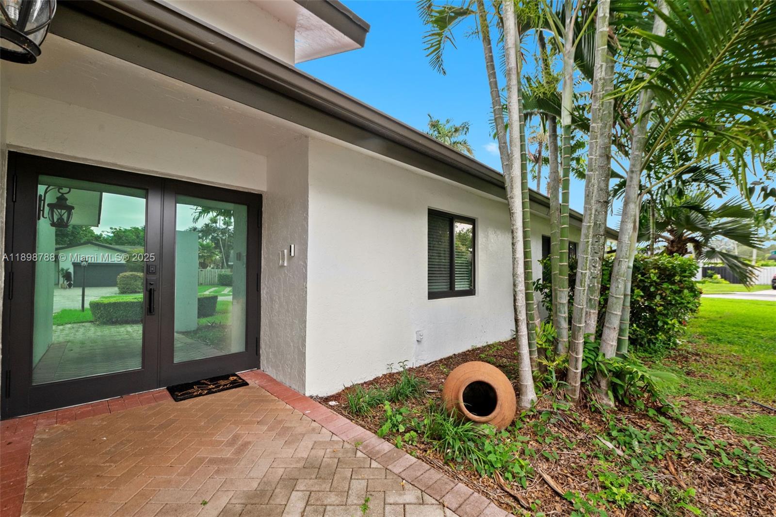 11471 Southwest 105th Terrace Miami, FL 33176 - Photo 2 of 41 a view of a backyard with a garden