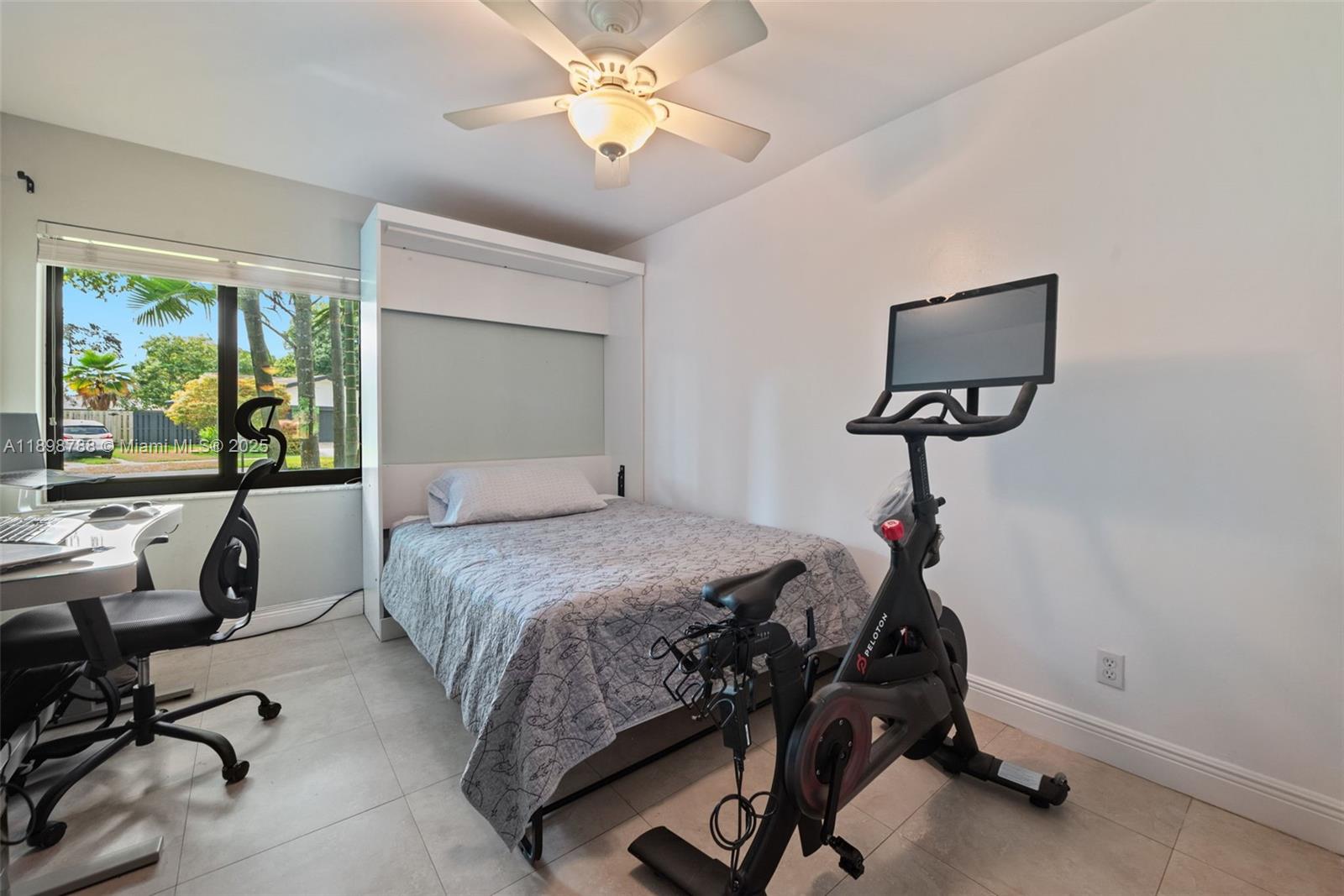 11471 Southwest 105th Terrace Miami, FL 33176 - Photo 21 of 41 a bedroom with furniture and a window