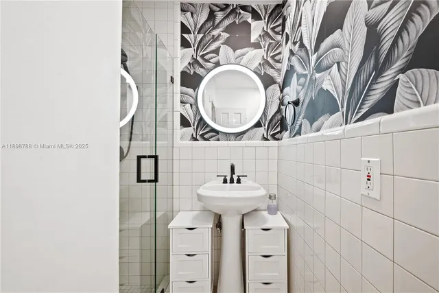 a bathroom with a sink and a mirror