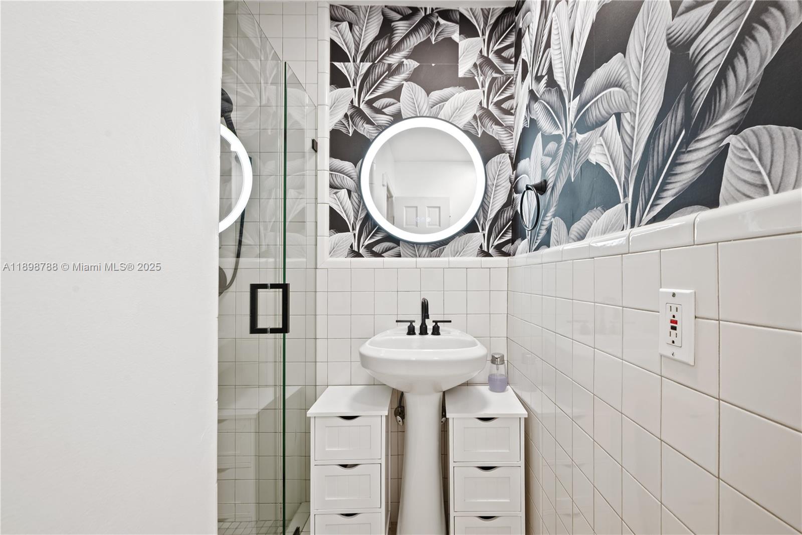 11471 Southwest 105th Terrace Miami, FL 33176 - Photo 25 of 41 a bathroom with a sink and a mirror