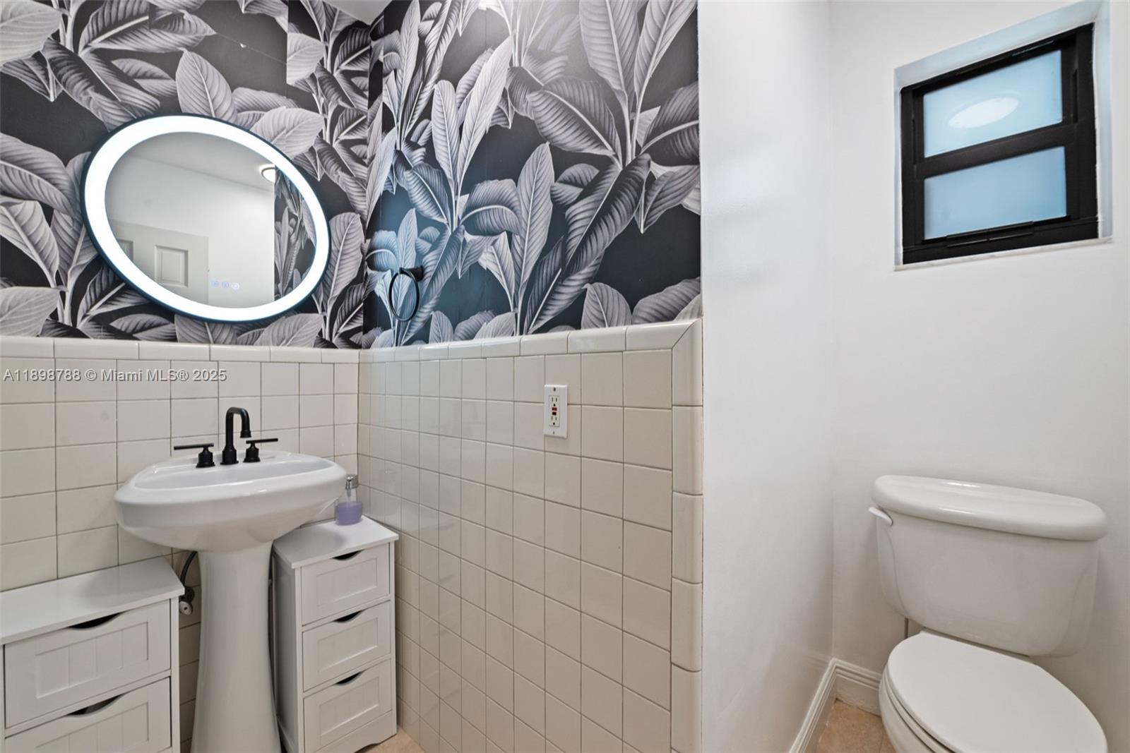 11471 Southwest 105th Terrace Miami, FL 33176 - Photo 26 of 41 a bathroom with a toilet sink and mirror