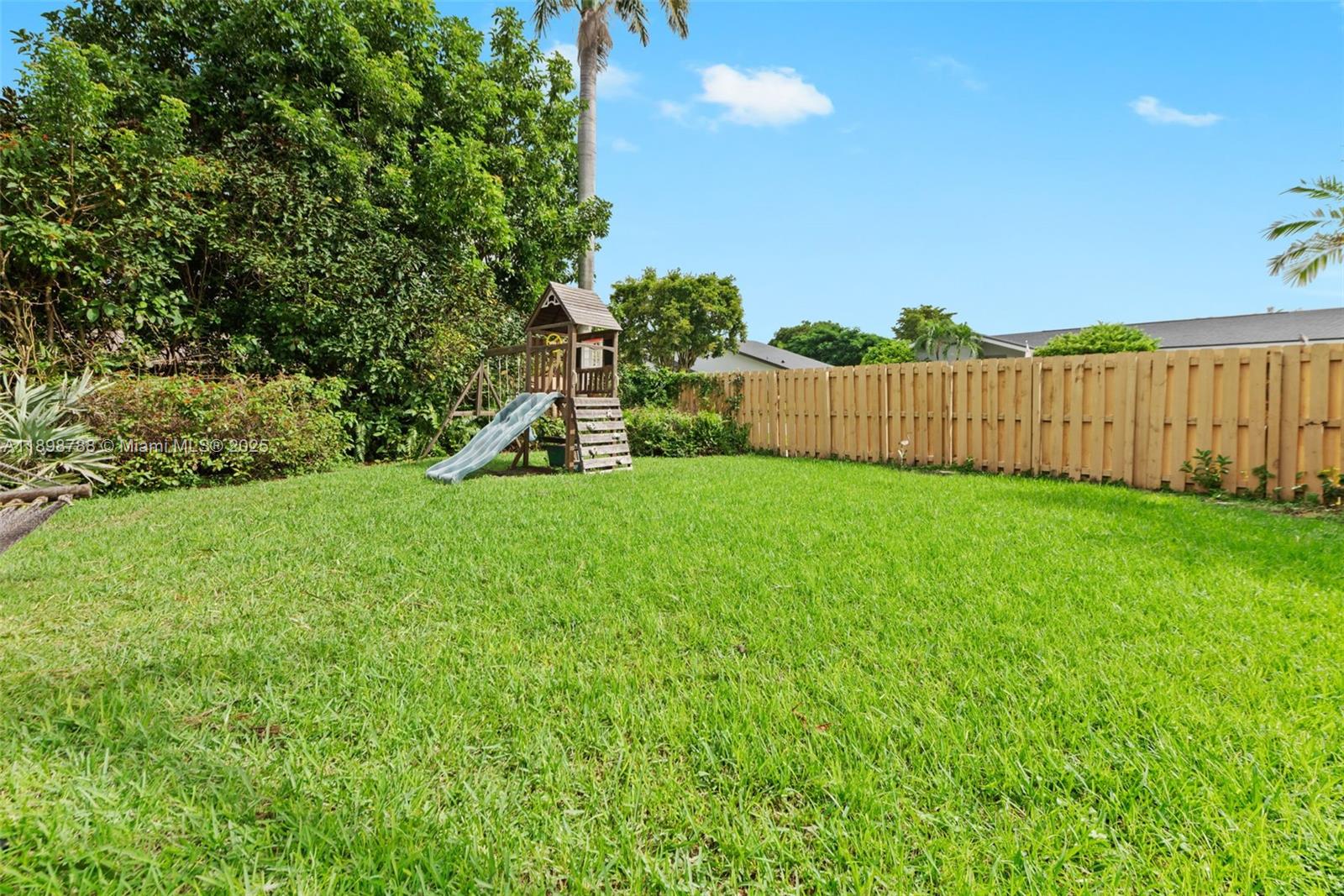 11471 Southwest 105th Terrace Miami, FL 33176 - Photo 30 of 41 a view of a backyard with a garden