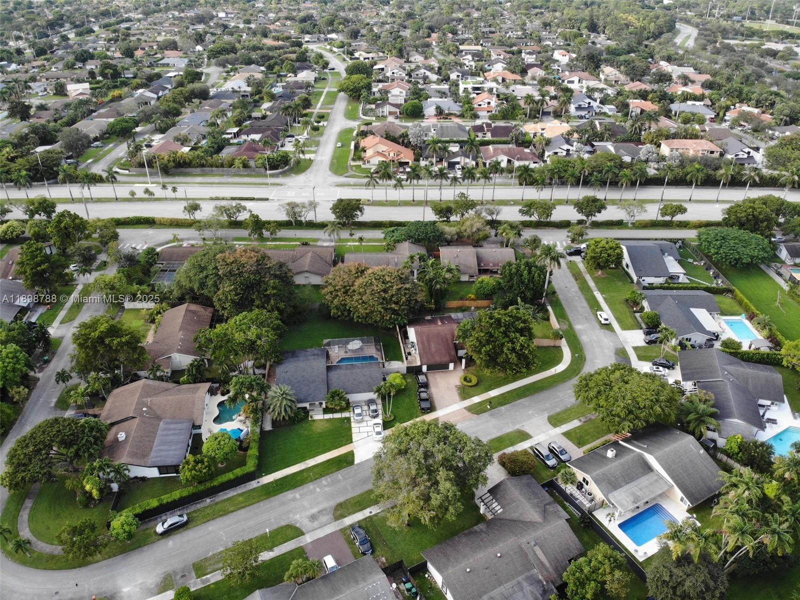 11471 Southwest 105th Terrace Miami, FL 33176 - Photo 36 of 41 an aerial view of residential houses with outdoor space and lake view