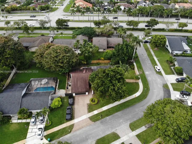 an aerial view of a house with outdoor space