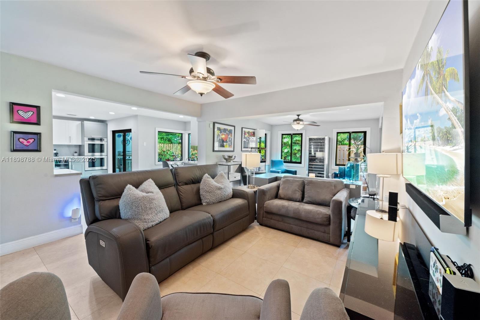 11471 Southwest 105th Terrace Miami, FL 33176 - Photo 5 of 41 a living room with furniture and a flat screen tv