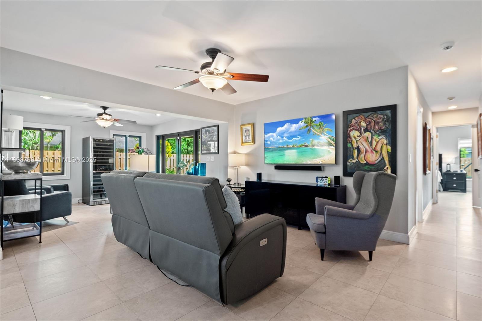 11471 Southwest 105th Terrace Miami, FL 33176 - Photo 6 of 41 a living room with furniture and a flat screen tv