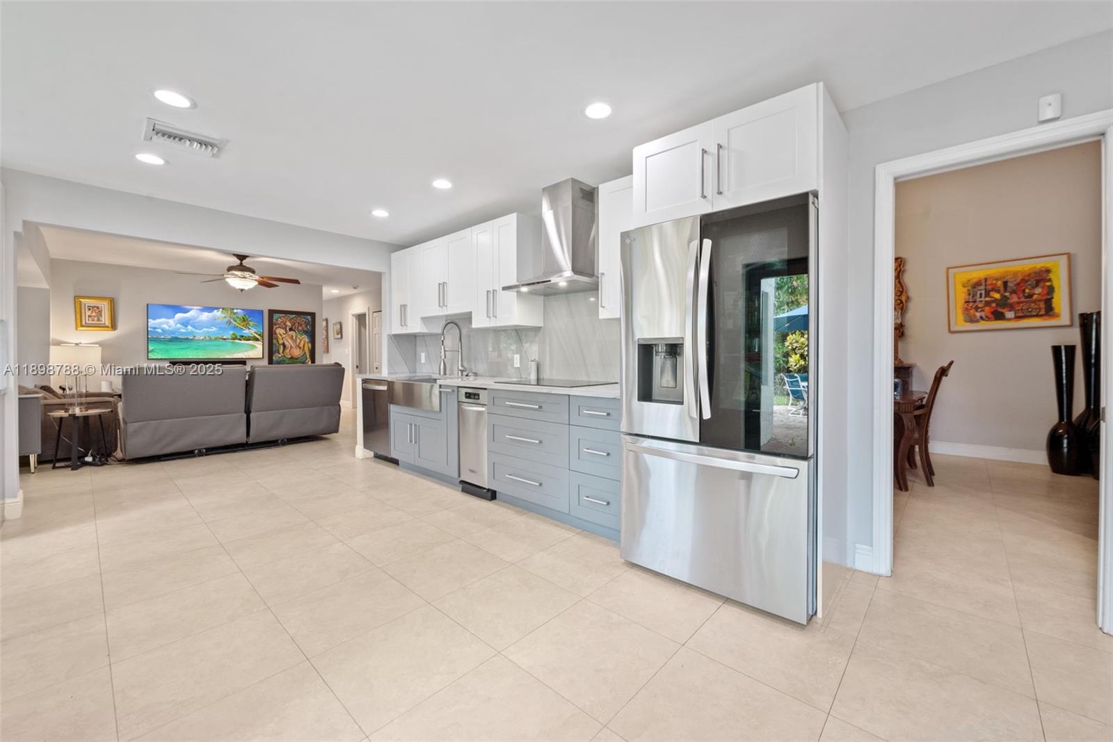 11471 Southwest 105th Terrace Miami, FL 33176 - Photo 9 of 41 a kitchen with stainless steel appliances a refrigerator sink and stove
