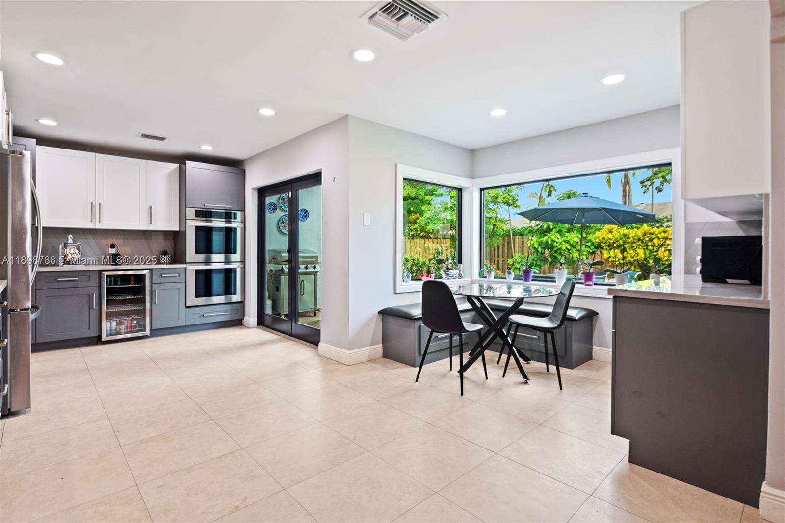 11471 Southwest 105th Terrace Miami, FL 33176 - Photo 10 of 41 a view of kitchen with furniture and large window