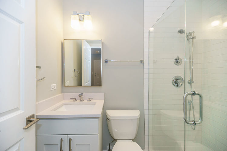 1915 West Irving Park Road, Unit 303 Chicago, IL 60613 - Photo 11 of 14 a bathroom with a sink toilet and shower