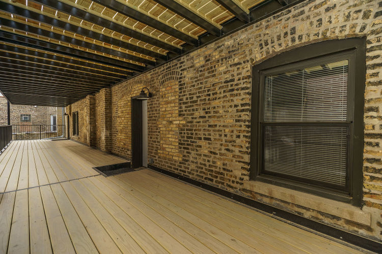 1915 West Irving Park Road, Unit 303 Chicago, IL 60613 - Photo 13 of 14 a view of empty room with wooden floor