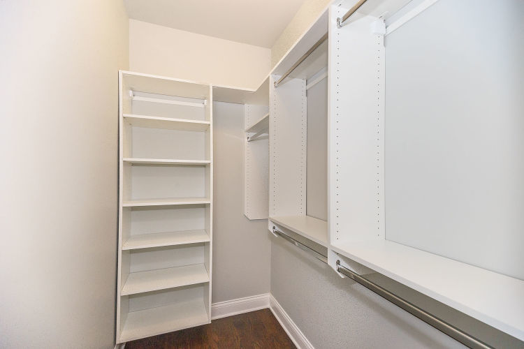 1915 West Irving Park Road, Unit 303 Chicago, IL 60613 - Photo 9 of 14 a view of walk in closet with empty racks