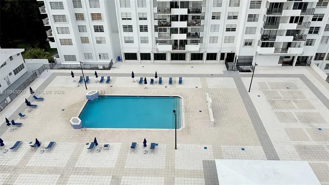 a tennis court with view of tall buildings