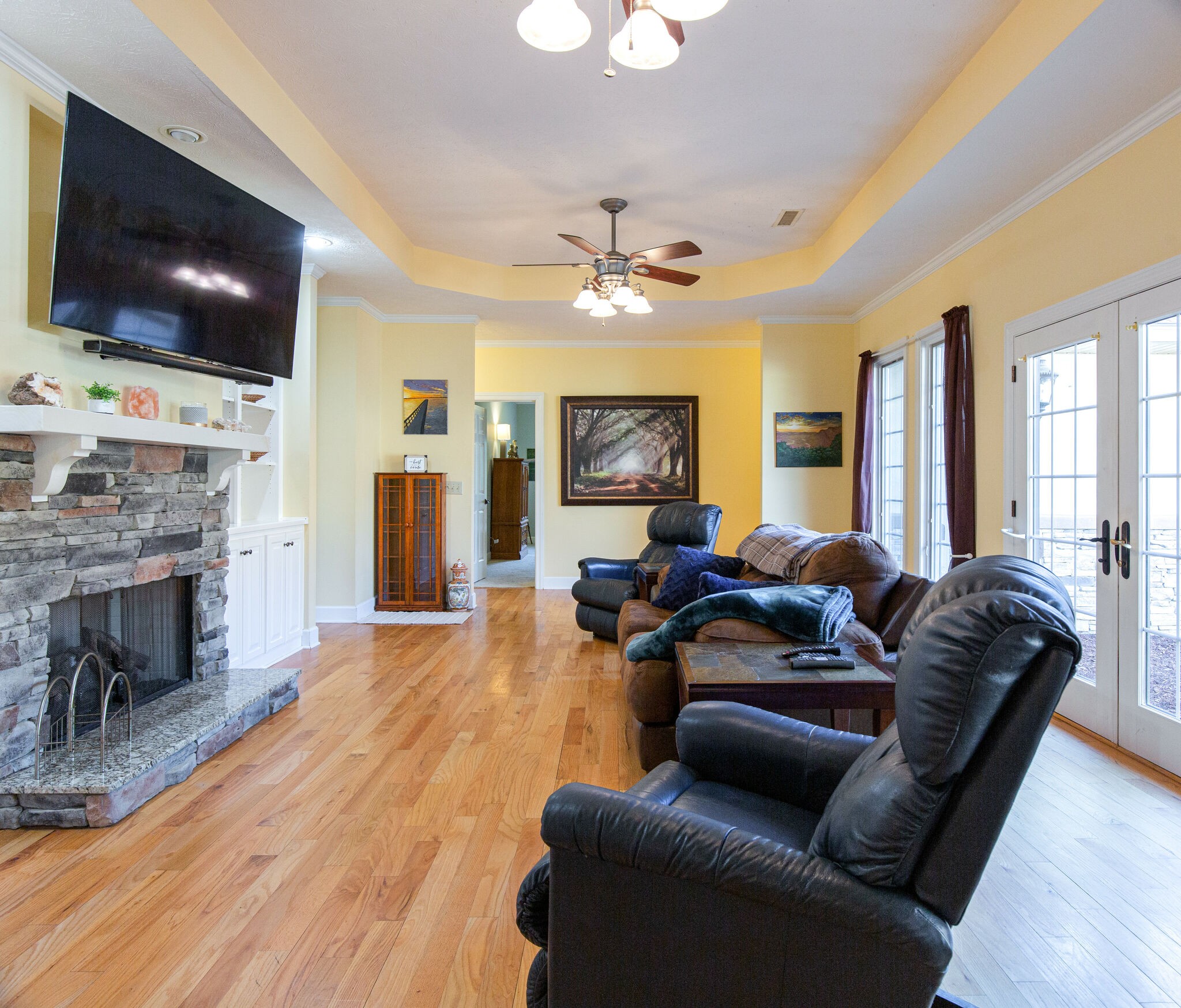 143 Sycamore Road Dickson, TN 37055 - Photo 11 of 36 a living room with furniture a flat screen tv and a fireplace