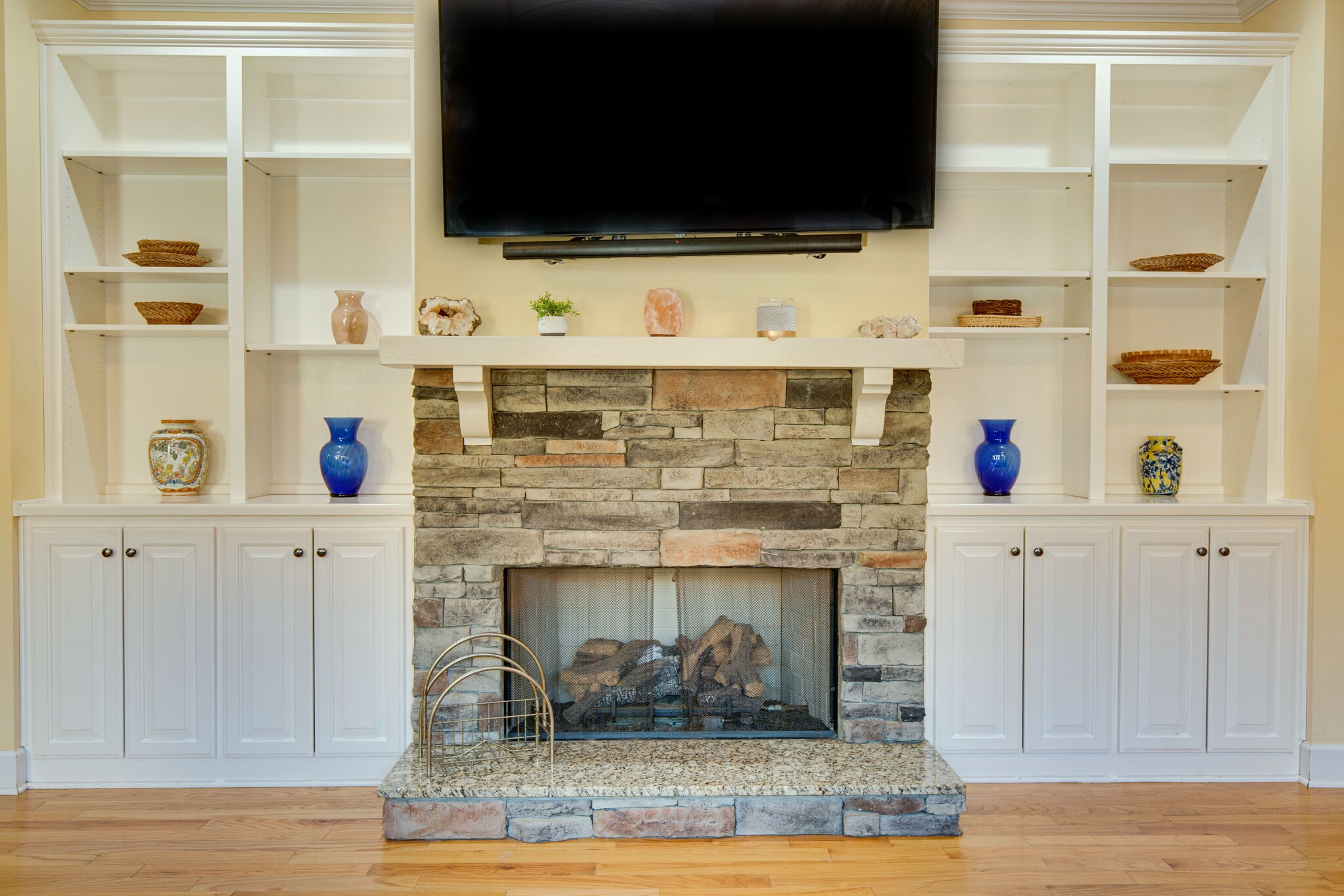 143 Sycamore Road Dickson, TN 37055 - Photo 12 of 36 a living room with flat screen tv and a fireplace