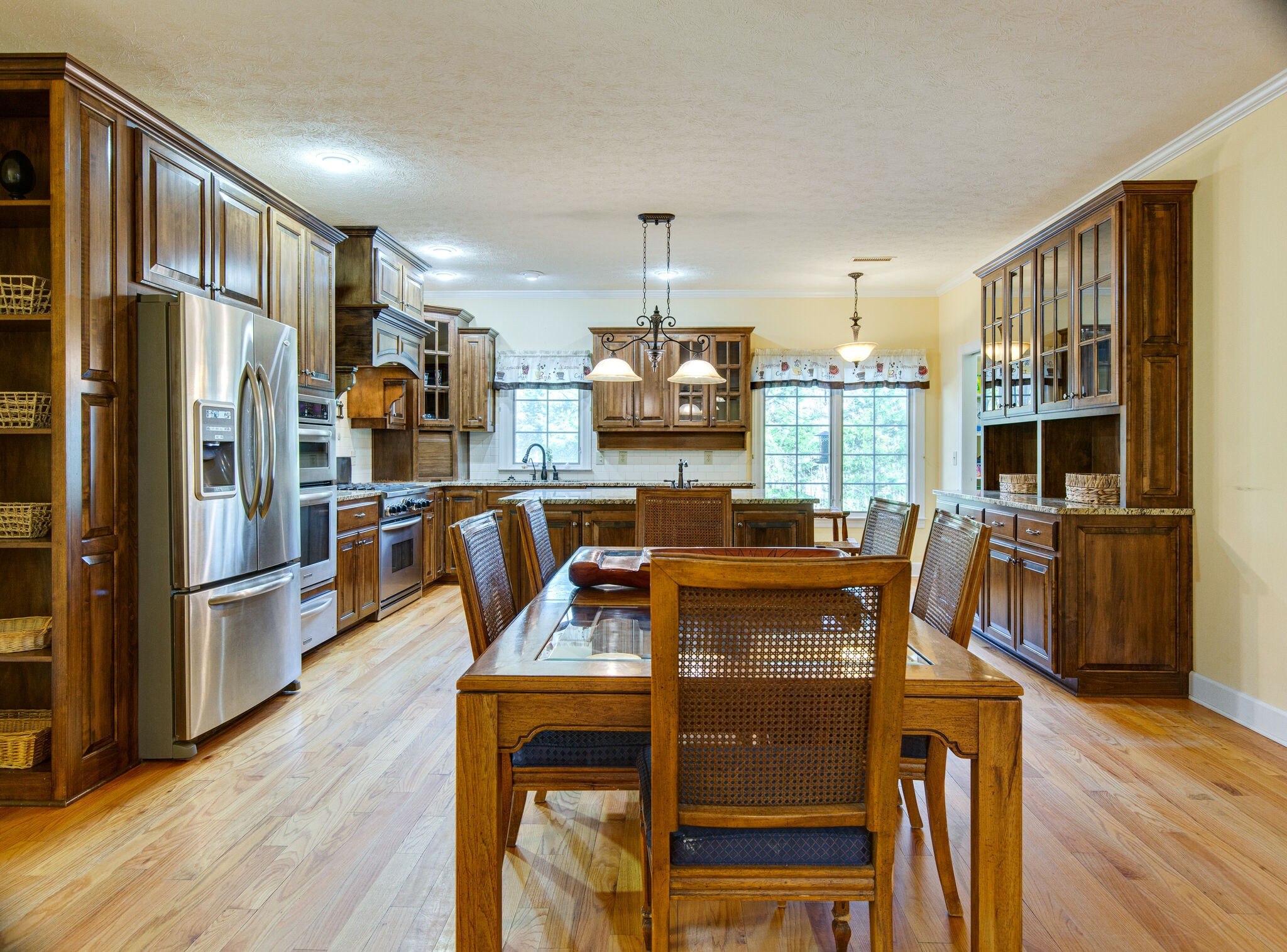 143 Sycamore Road Dickson, TN 37055 - Photo 14 of 36 a dining room with furniture a kitchen view and wooden floor