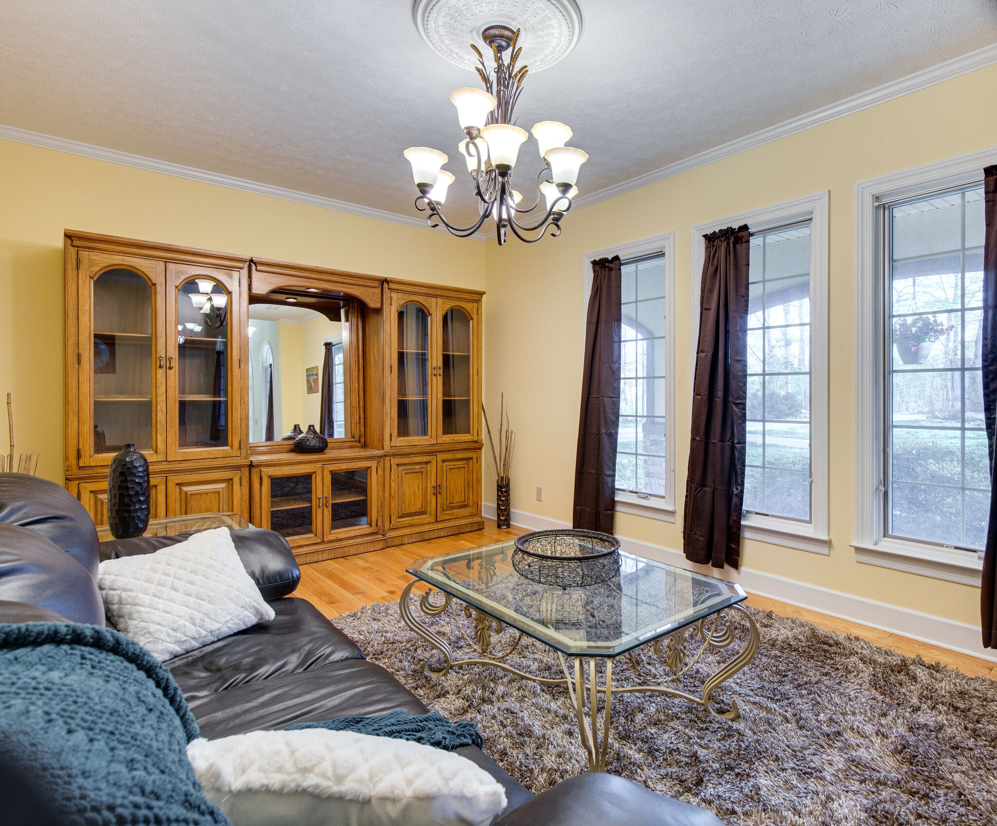 143 Sycamore Road Dickson, TN 37055 - Photo 17 of 36 a living room with fireplace furniture and a chandelier
