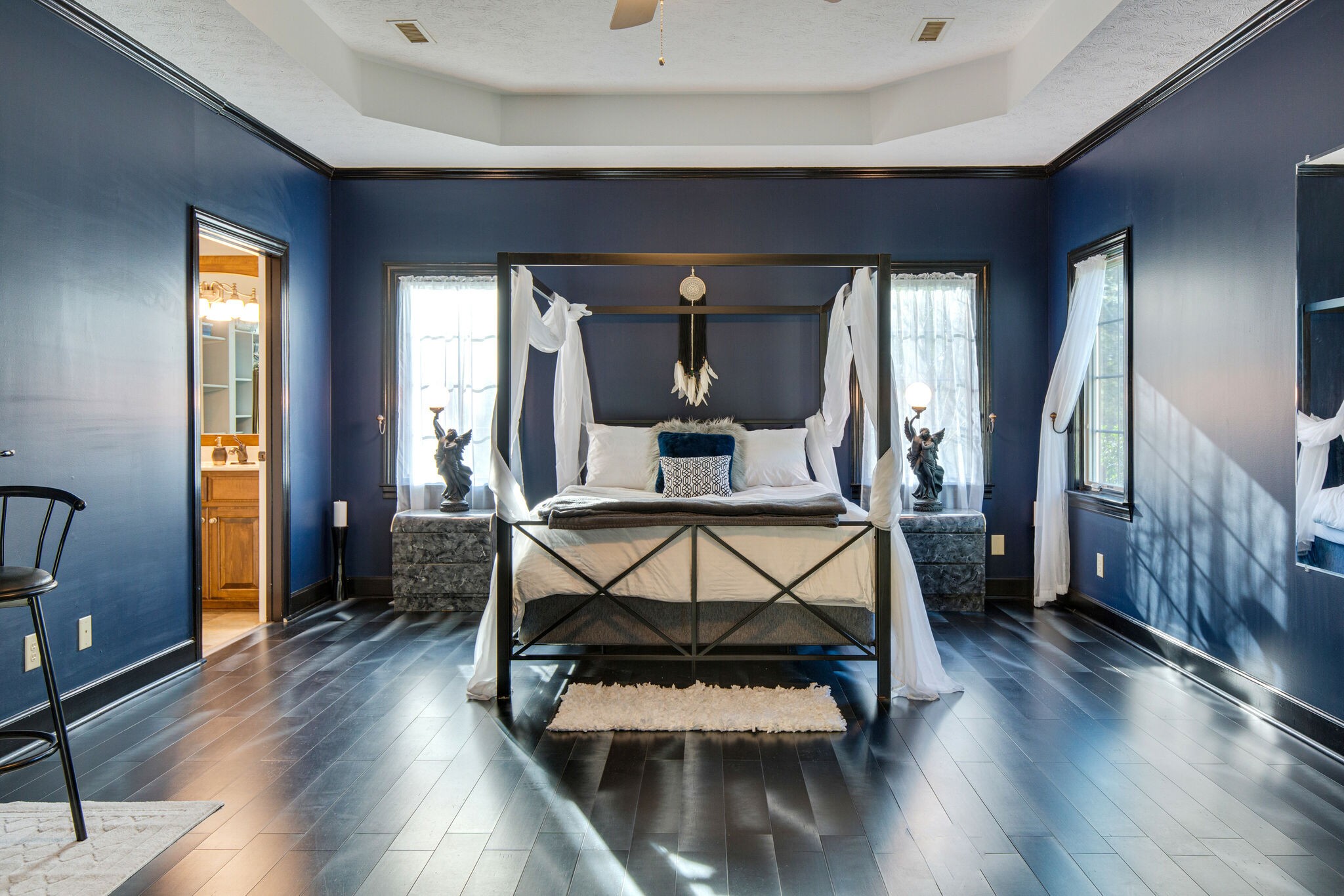 143 Sycamore Road Dickson, TN 37055 - Photo 18 of 36 a bedroom with furniture window and wooden floor