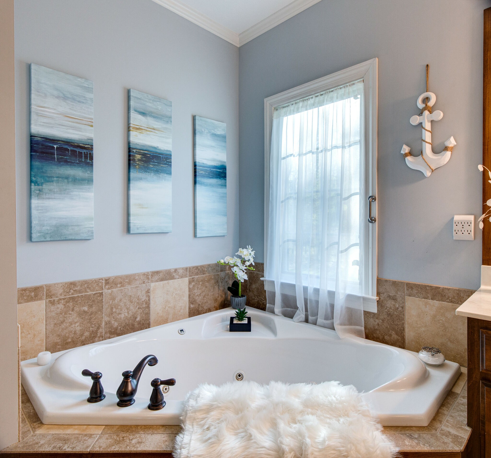 143 Sycamore Road Dickson, TN 37055 - Photo 21 of 36 a bath tub sitting in a bathroom next to a window