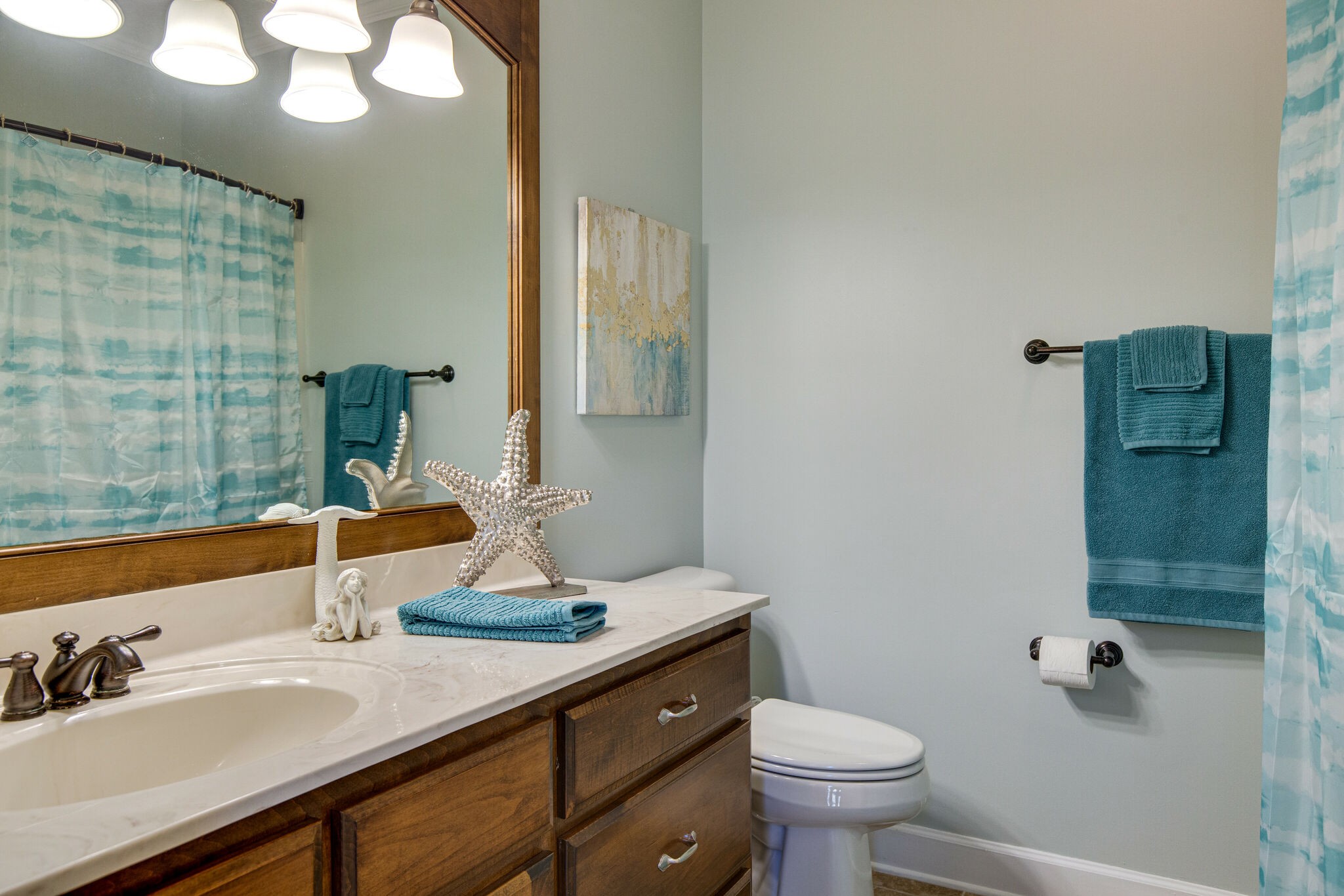 143 Sycamore Road Dickson, TN 37055 - Photo 24 of 36 a bathroom with a sink and a toilet