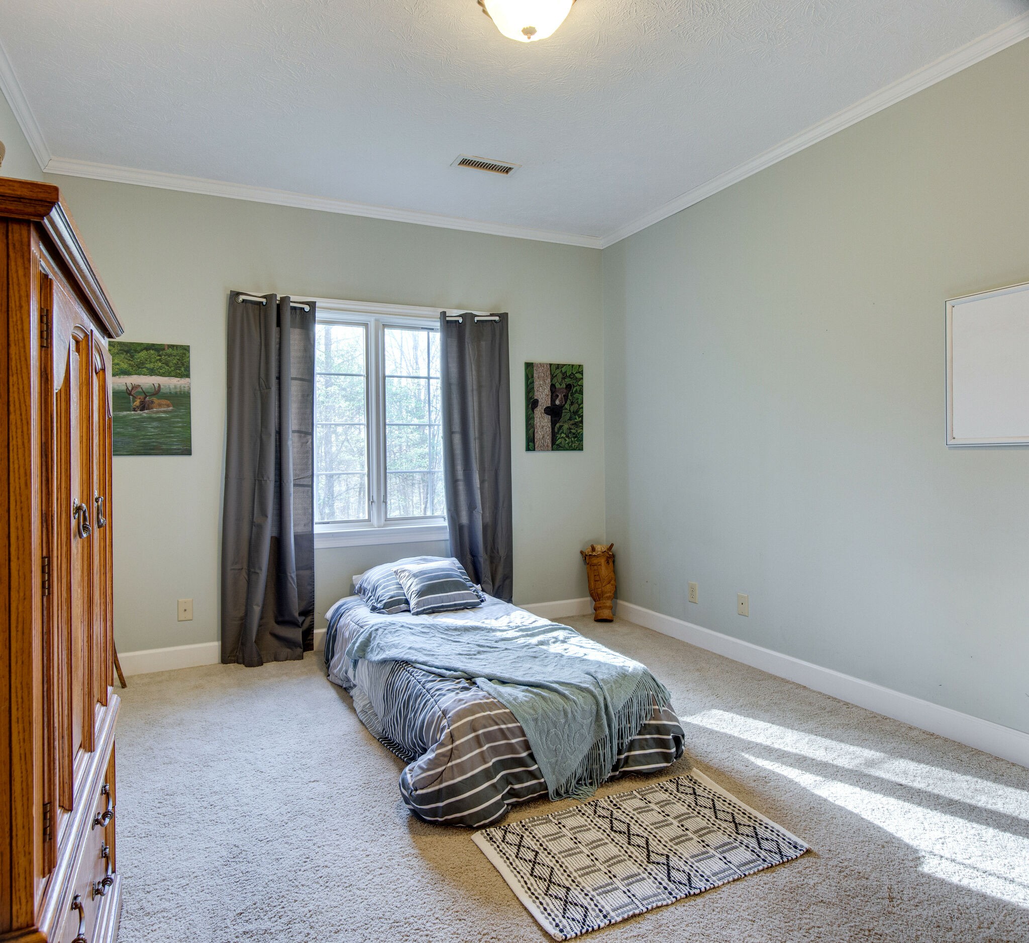 143 Sycamore Road Dickson, TN 37055 - Photo 25 of 36 a bedroom with a bed and a window