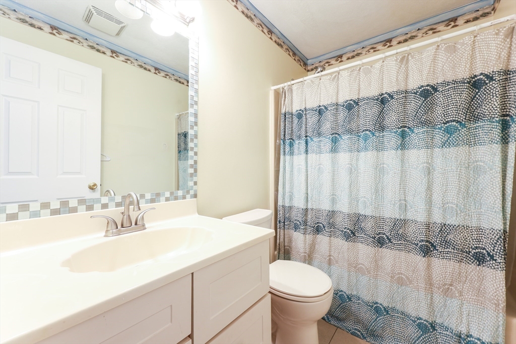 6 Erick Road, Unit 73 Mansfield, MA 02048 - Photo 11 of 21 a bathroom with a sink and a mirror