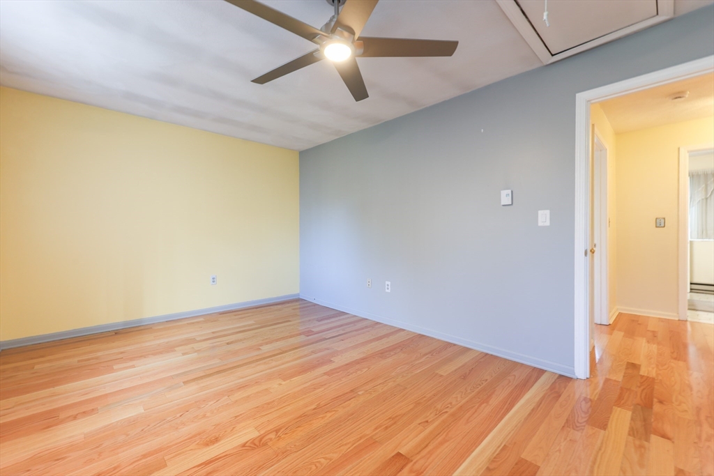 6 Erick Road, Unit 73 Mansfield, MA 02048 - Photo 12 of 21 a view of empty room with wooden floor