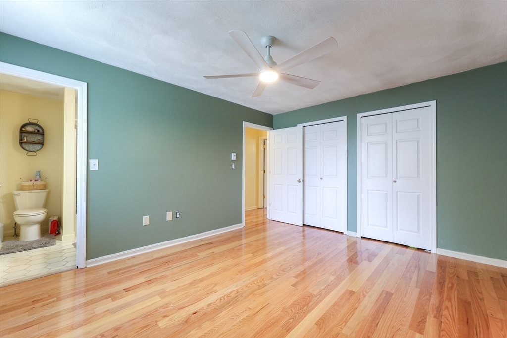 6 Erick Road, Unit 73 Mansfield, MA 02048 - Photo 16 of 21 a view of an empty room with wooden floor