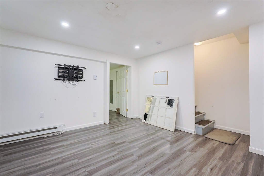 6 Erick Road, Unit 73 Mansfield, MA 02048 - Photo 20 of 21 a view of empty room with wooden floor