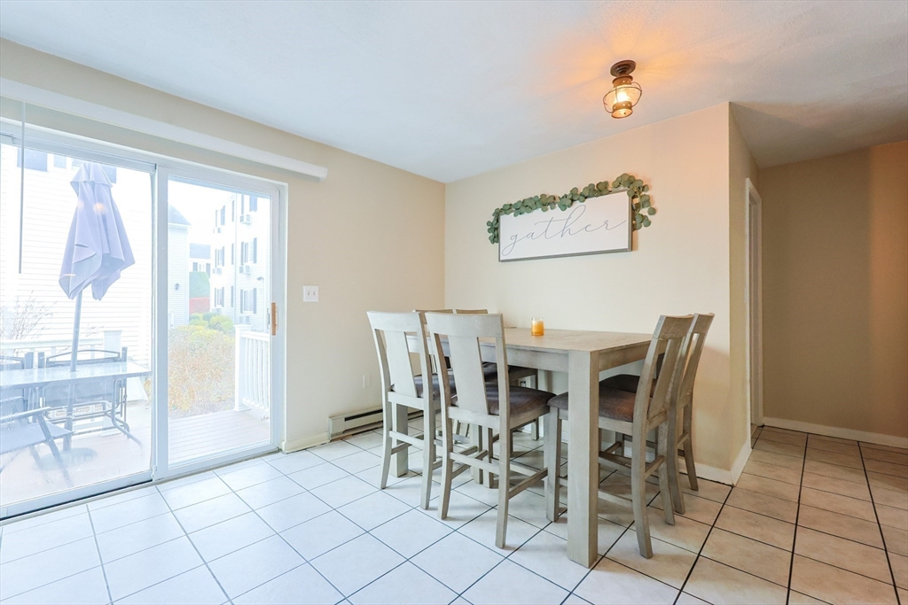 6 Erick Road, Unit 73 Mansfield, MA 02048 - Photo 10 of 21 a view of a dining room with furniture and a table