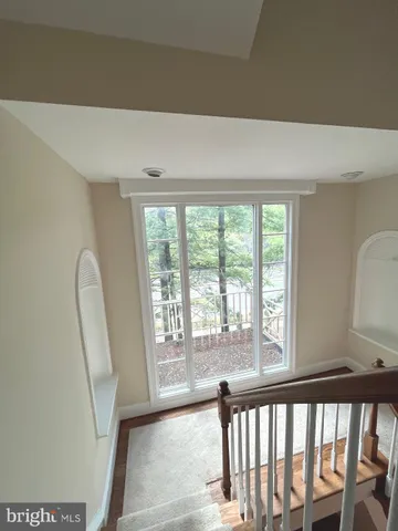 a view of entryway with wooden floor