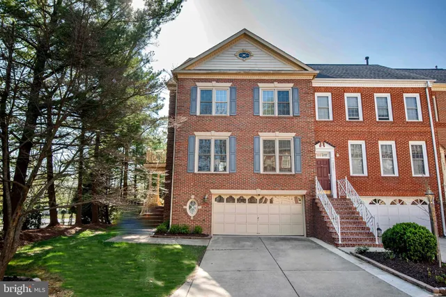 a view of a brick house with a yard
