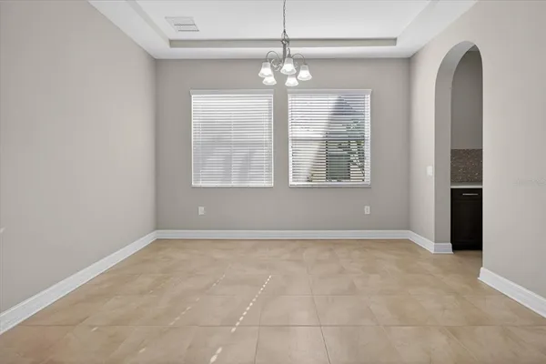 a kitchen with stainless steel appliances a refrigerator and a stove top oven