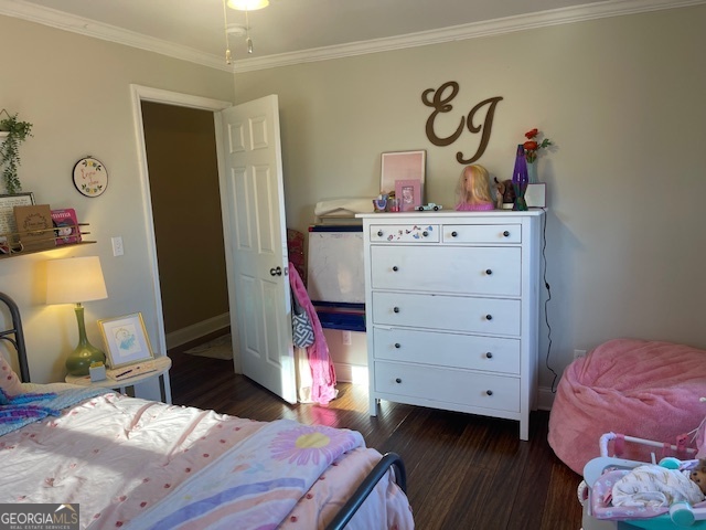 425 Trice Cemetery Road Thomaston, GA 30286 - Photo 19 of 30 a bedroom with a bed and wooden floor