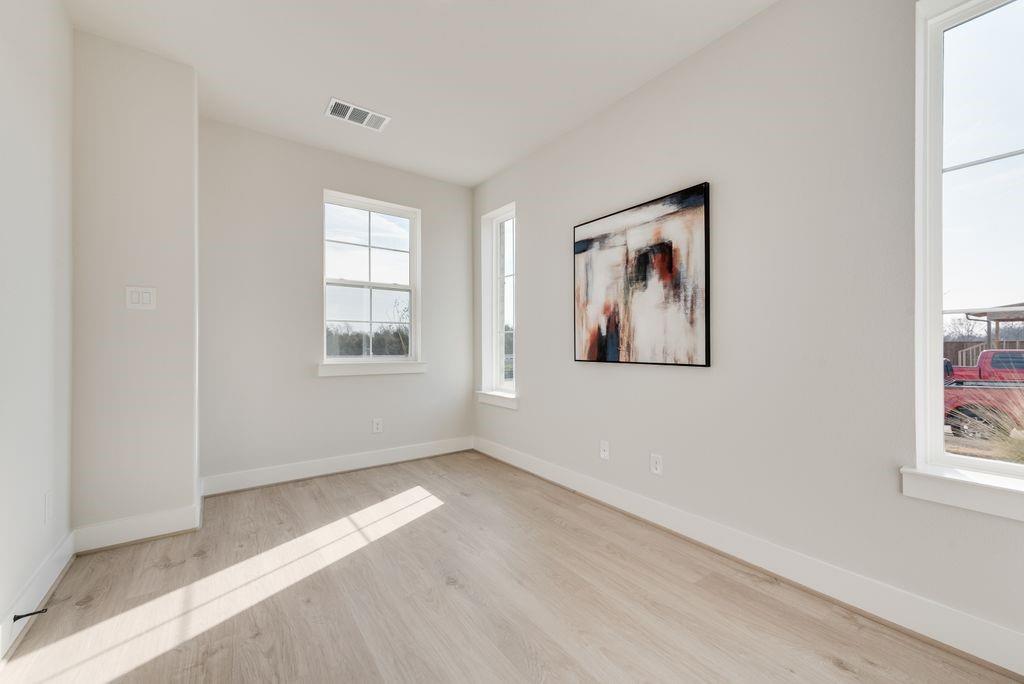 12703 Pine Ridge Trail Rowlett, TX 75089 - Photo 20 of 30 an empty room with windows and closet
