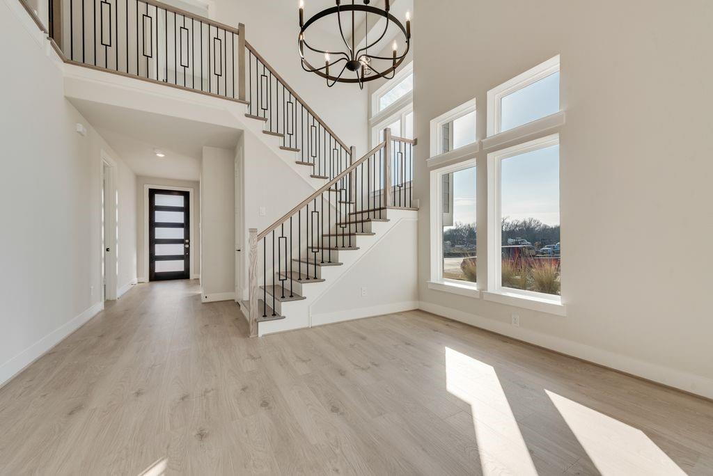 12703 Pine Ridge Trail Rowlett, TX 75089 - Photo 2 of 30 a view of an entryway with wooden floor