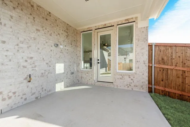 a view of a house with a big yard and large tree