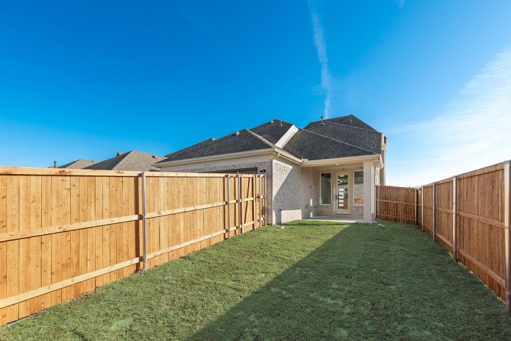 12703 Pine Ridge Trail Rowlett, TX 75089 - Photo 29 of 30 a view of a house with a big yard and large tree