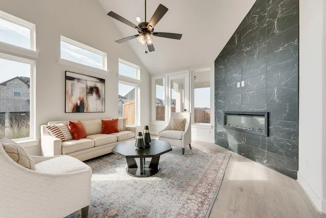 a living room with furniture and a large window