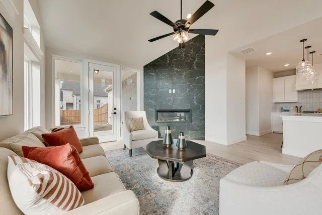 a living room with furniture and a fireplace