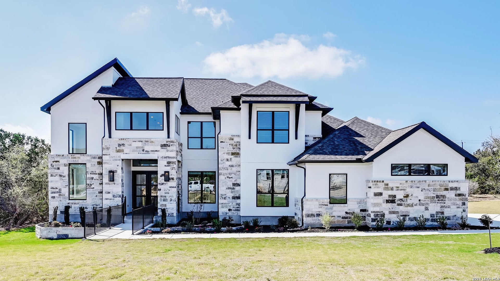 a front view of a house with a yard