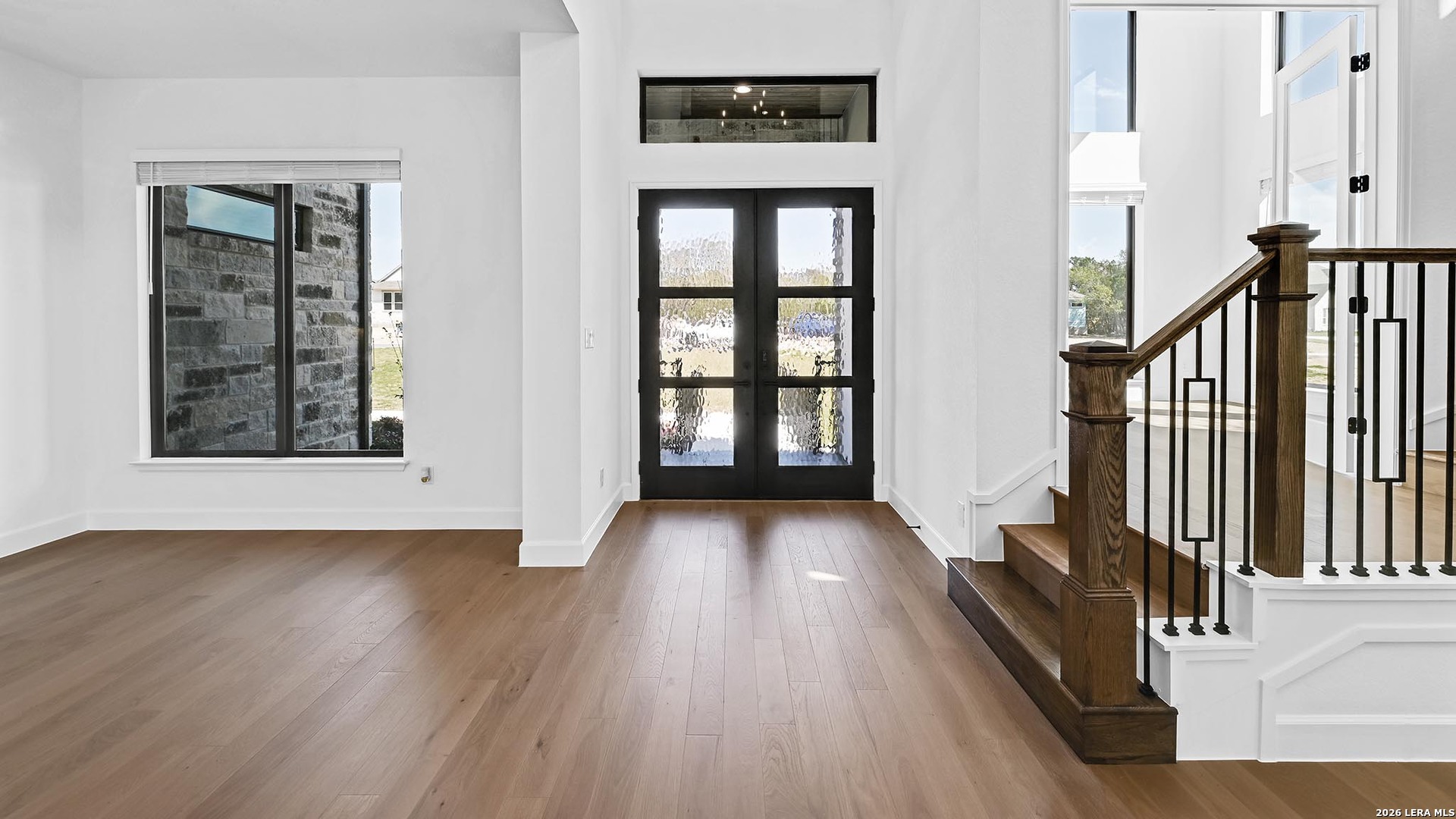1006 Rapidan Lane Bulverde, TX 78163 - Photo 16 of 26 wooden floor with a window in a hall with wooden floor