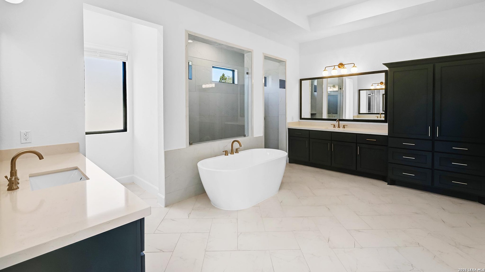 1006 Rapidan Lane Bulverde, TX 78163 - Photo 20 of 26 a bathroom with a bathtub sink and mirror