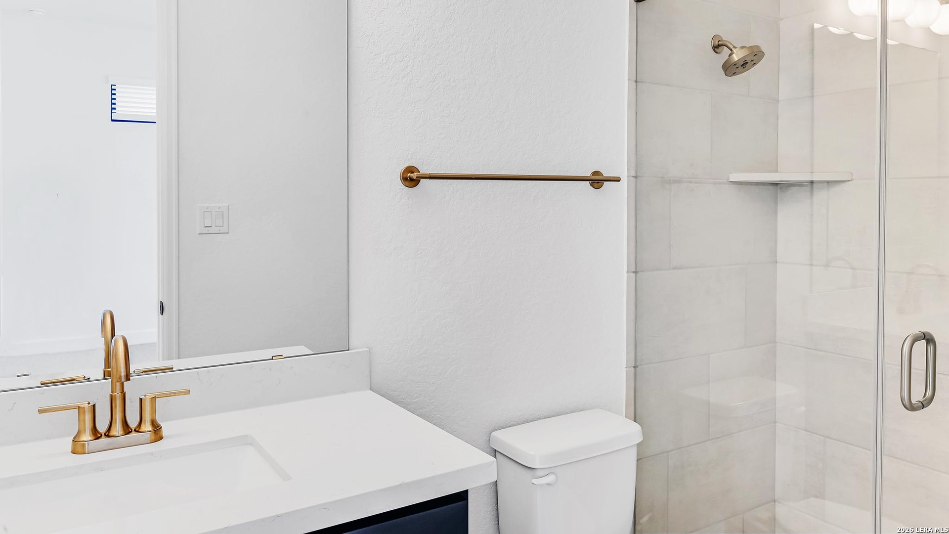 1006 Rapidan Lane Bulverde, TX 78163 - Photo 22 of 26 a bathroom with a sink and a toilet