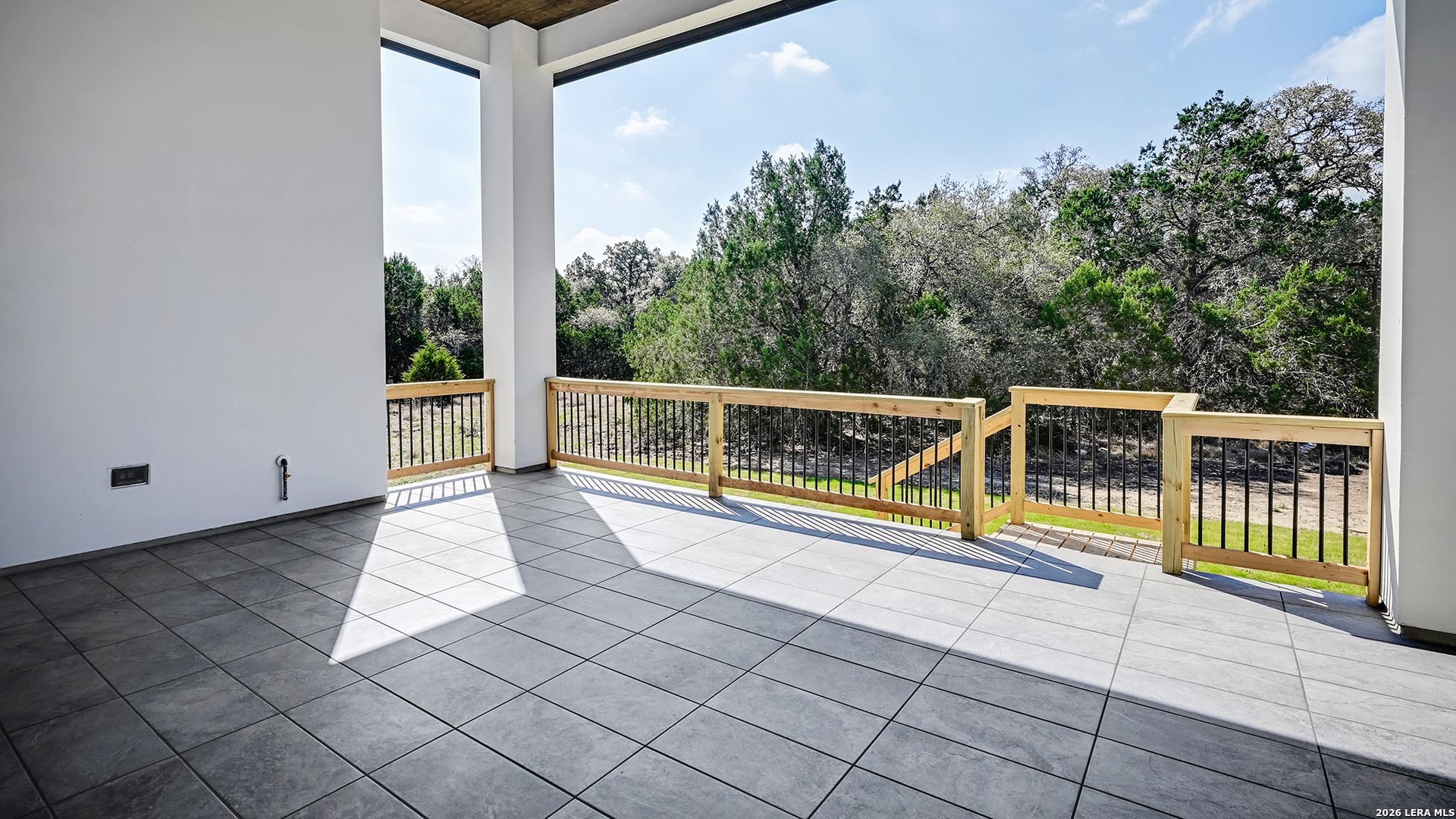 1006 Rapidan Lane Bulverde, TX 78163 - Photo 6 of 26 a view of a balcony with floor to ceiling windows