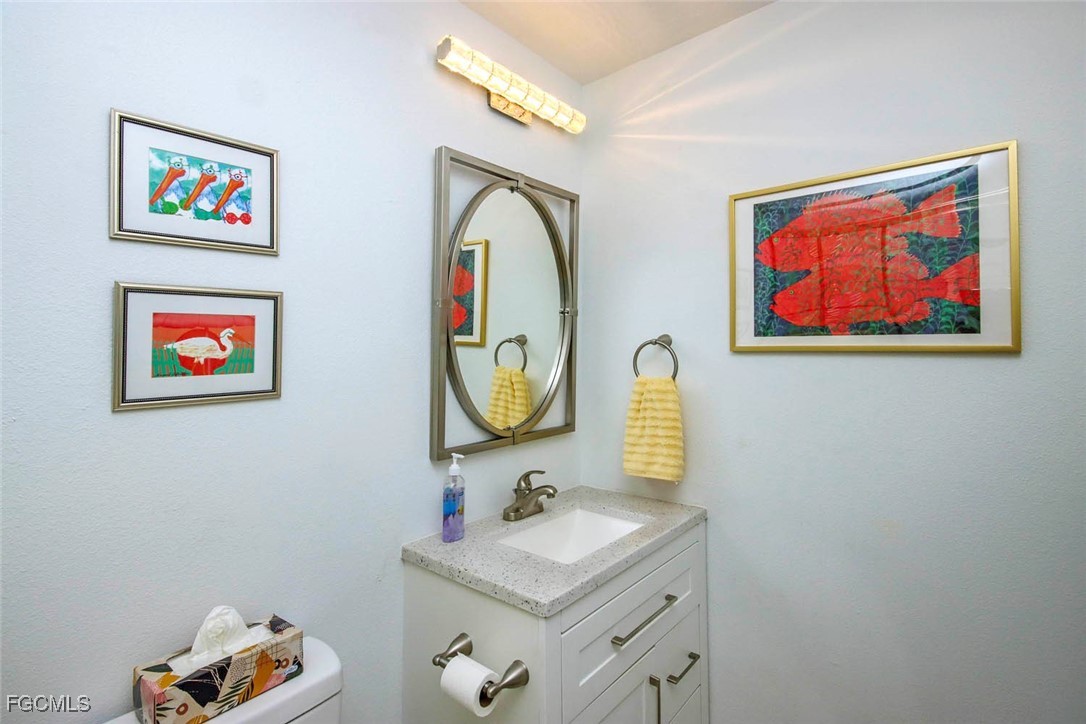 641 Periwinkle Way, Unit A3 Sanibel, FL 33957 - Photo 12 of 26 a bathroom with a sink and a mirror