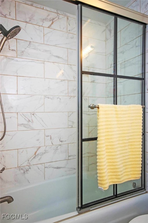 641 Periwinkle Way, Unit A3 Sanibel, FL 33957 - Photo 13 of 26 a bathroom with a bathtub and shower