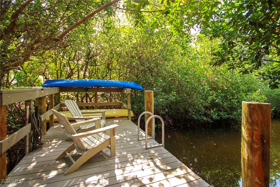 641 Periwinkle Way, Unit A3 Sanibel, FL 33957 - Photo 3 of 26 a view of a balcony with chairs