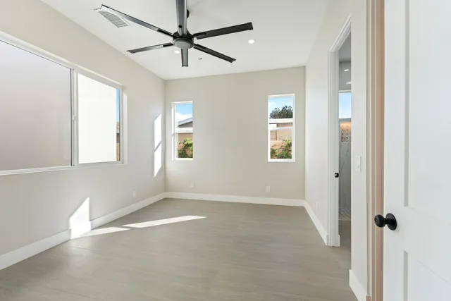a bathroom with a sink toilet a mirror and shower