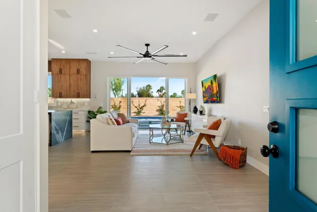 a bathroom with a sink and mirror with toilet