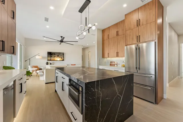 a view of a hallway with a room and a livingroom